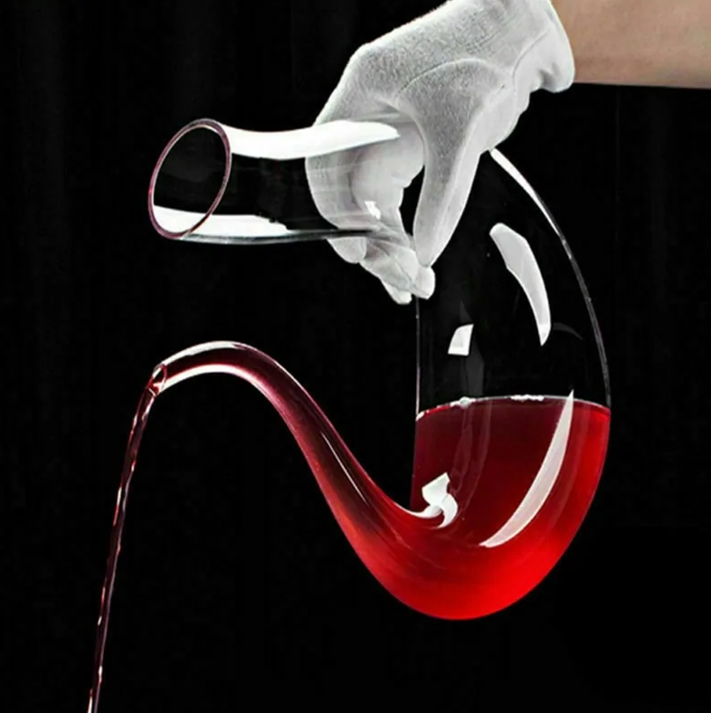 Swan shaped wine decanter. Filled from larger end and poured from smaller end.